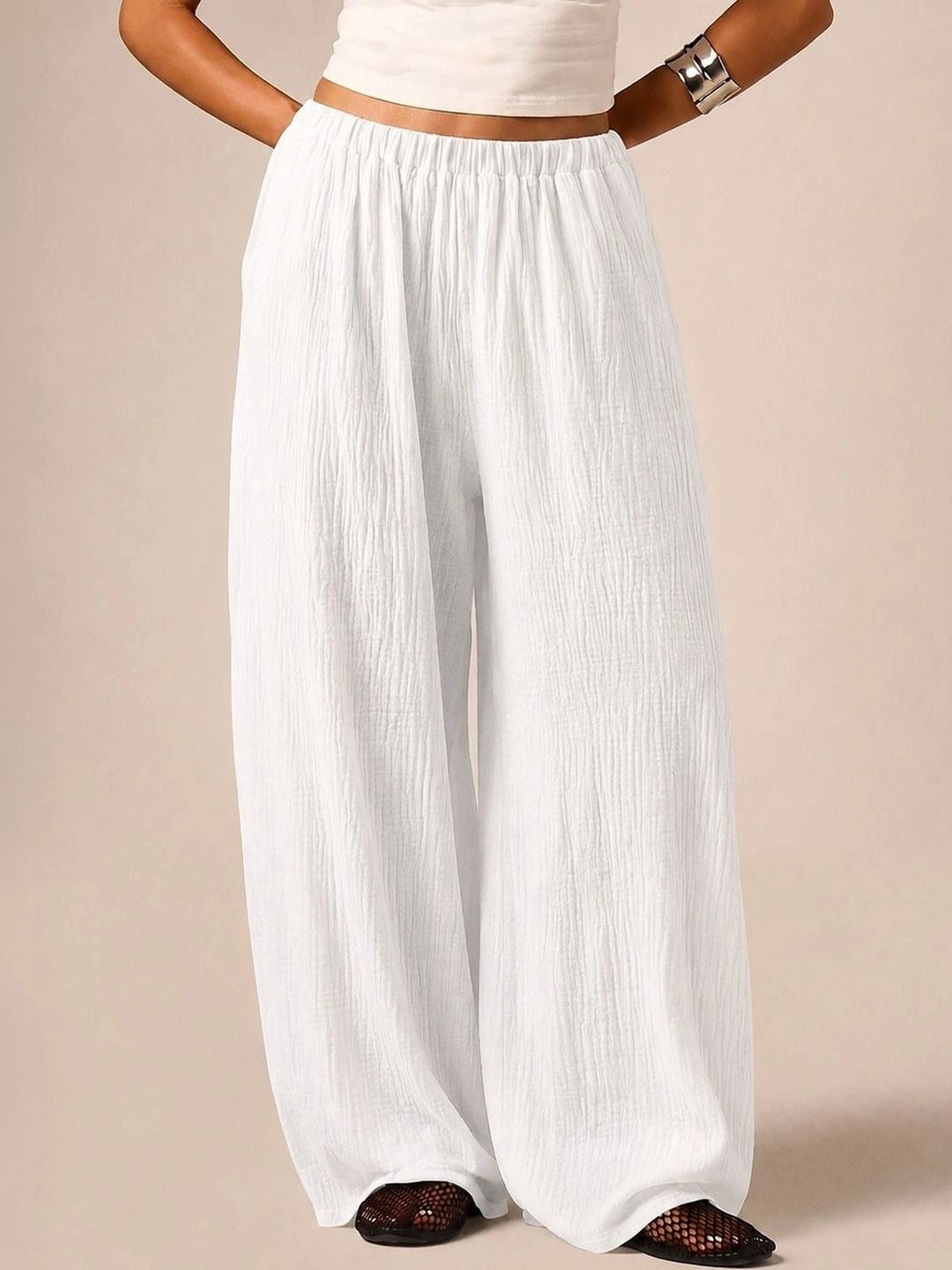 White textured wide-leg track pants — front view