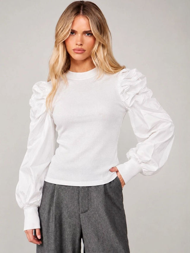Front view of Cloud White Sculpted Puff-Sleeve Top with ribbed body and gathered long sleeves