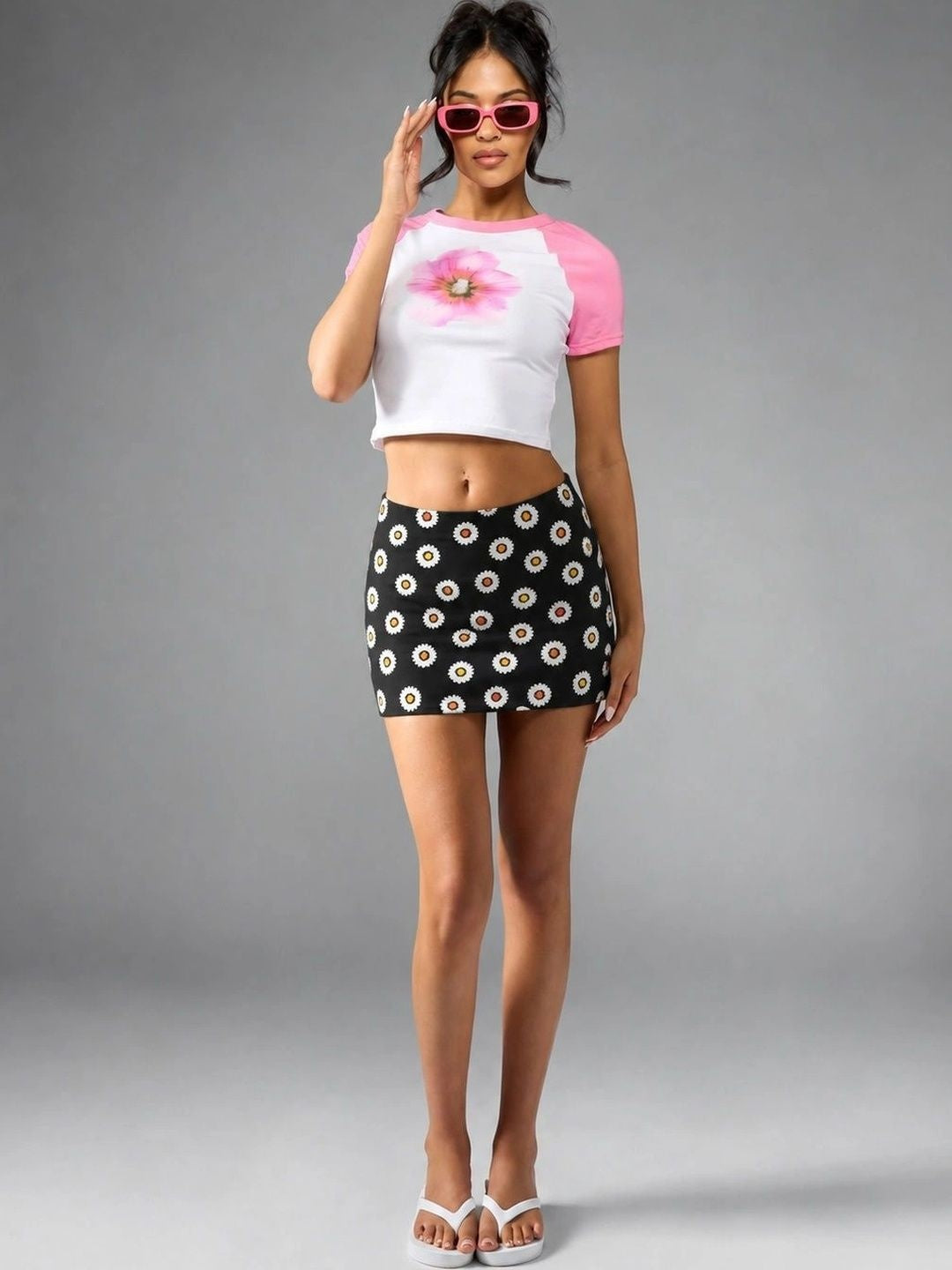 Daisy Pop Black Cotton Mini Skirt with white daisy print — full front view