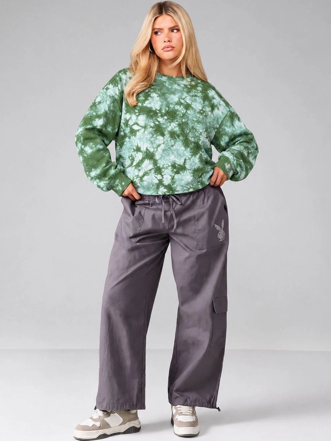 Full-length outfit featuring Forest Haze Green Tie-Dye Oversized Sweatshirt styled with grey cargo trousers