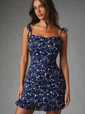 Front view of Midnight Daisy Tie-Strap Ruffle Mini Dress in navy floral print