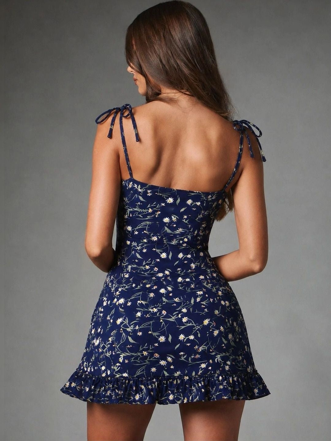 Back view of Midnight Daisy Tie-Strap Ruffle Mini Dress with bow shoulder ties